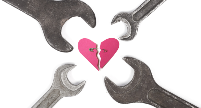 wrenches surrounding wounded heart